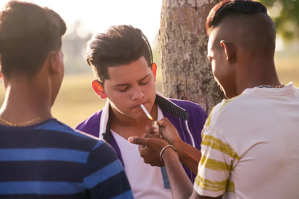 Kids,Smoking,Cigarette,In,Park.,Concept,Of,Health,Problems,And