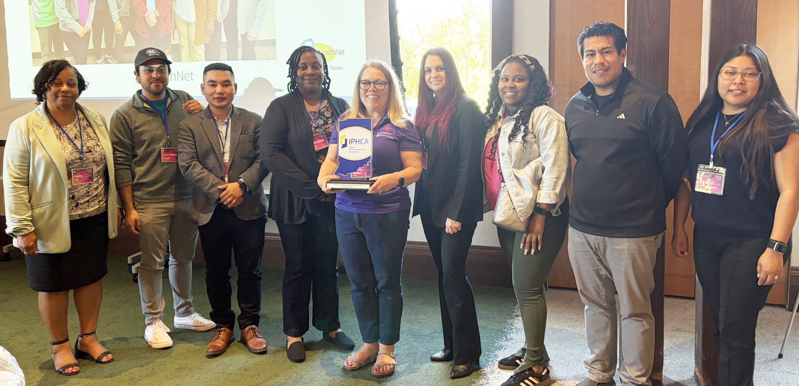 The HealthNet O&E Team accepting their True North award