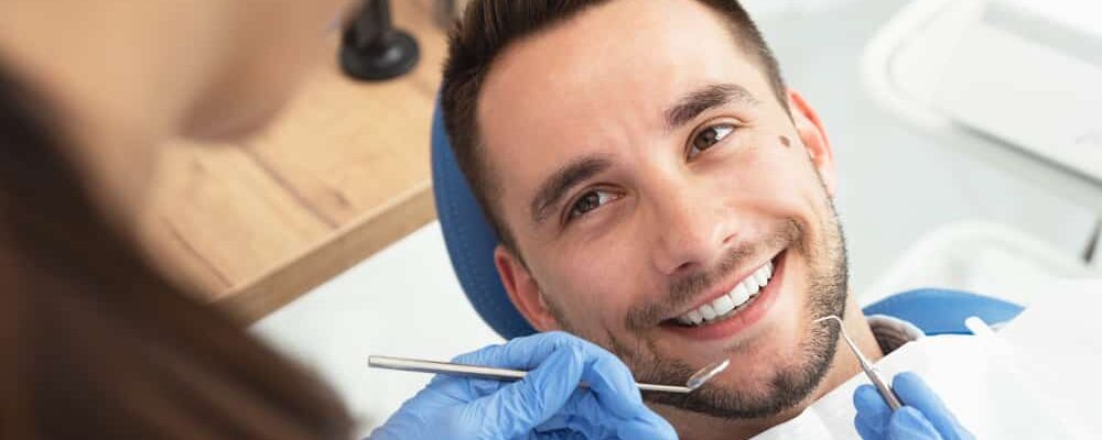 Man,Having,A,Visit,At,The,Dentist's.,Handsome,Patient,Sitting